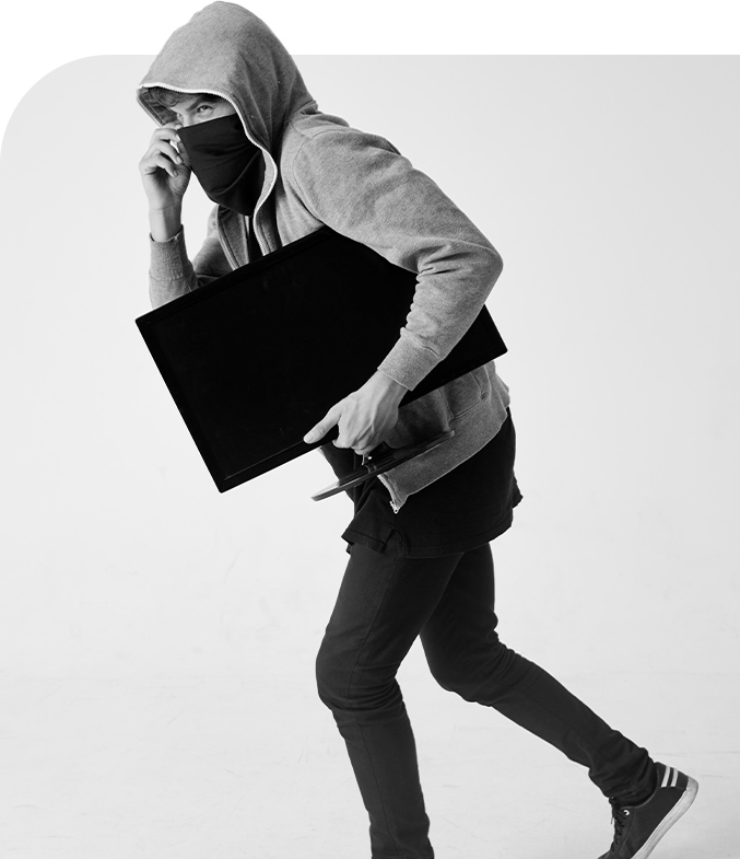 Person in hoodie and mask carrying a folder